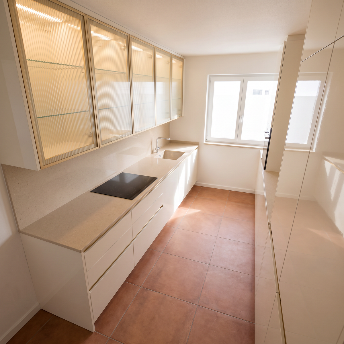 Juniper Galley seen from above, showing the beige quartz worktop, hob, sink and terracotta floor