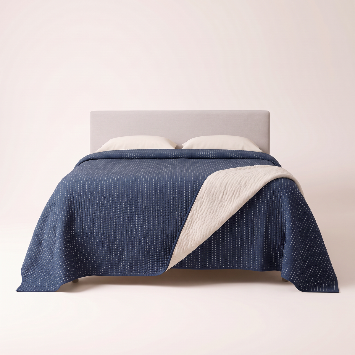 Kantha Quilted Coverlet indigo with ivory kantha stitching, view from the foot of the bed