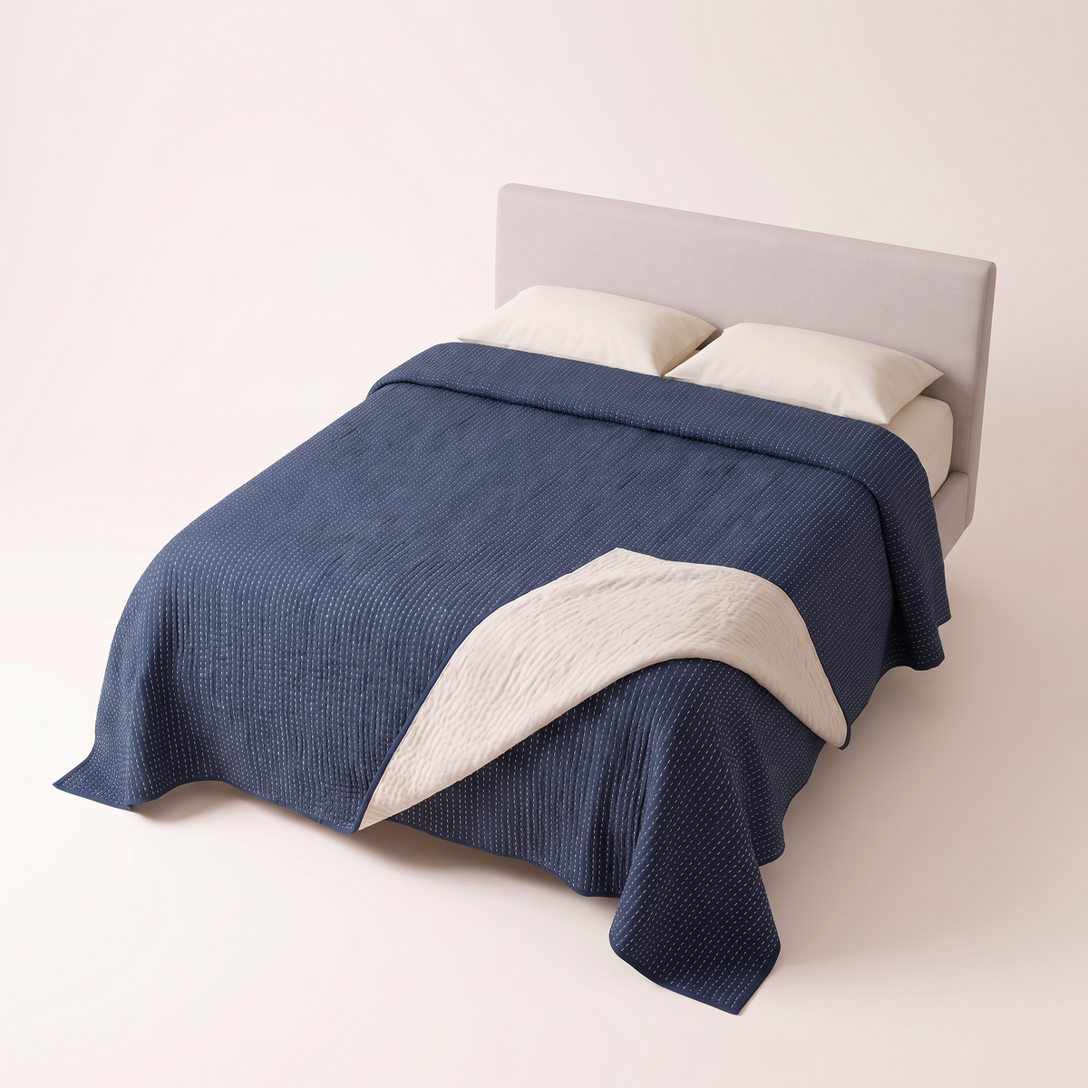 Kantha Quilted Coverlet indigo quilted bedcover with ivory reverse, elevated three-quarter view