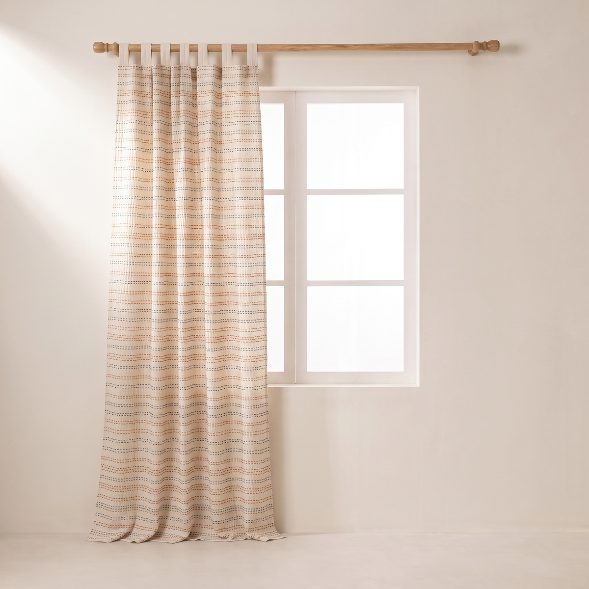 Kantha Stitch curtains gathered open to one side of the window