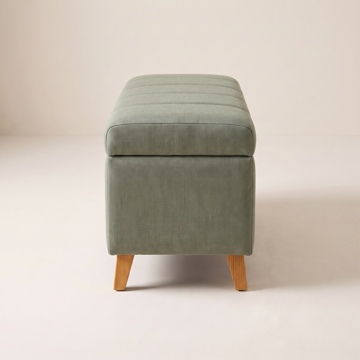 Keel Storage Bench in sage fabric on splayed ash legs, end view