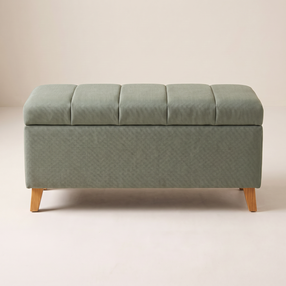 Keel Storage Bench in sage fabric with five channel-stitched lid bands, front elevation