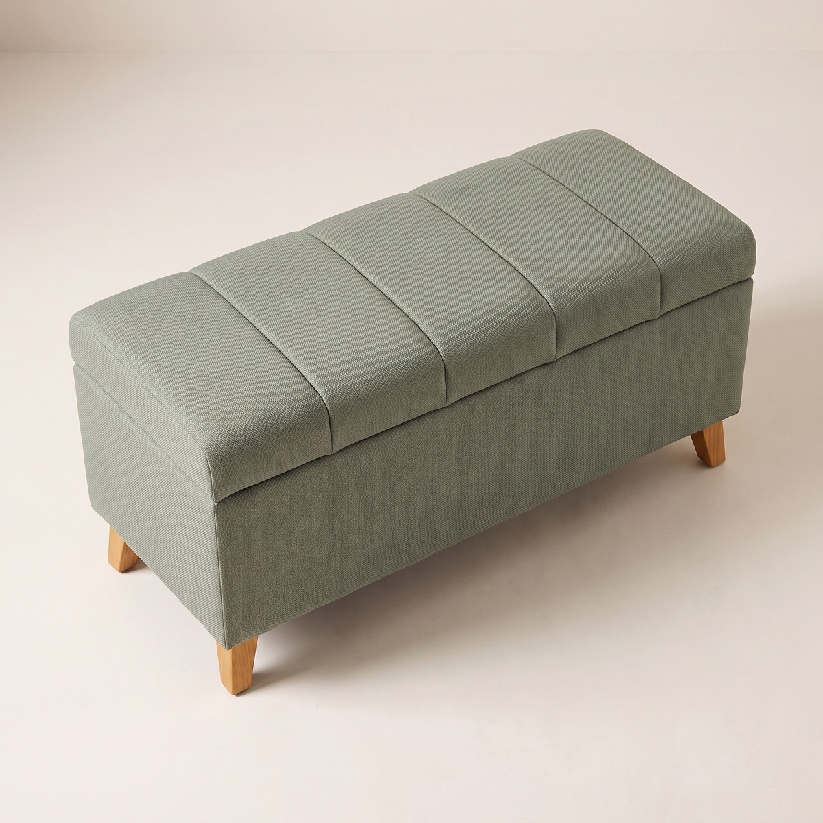 Keel Storage Bench in sage fabric, elevated view of the channel-stitched padded lid
