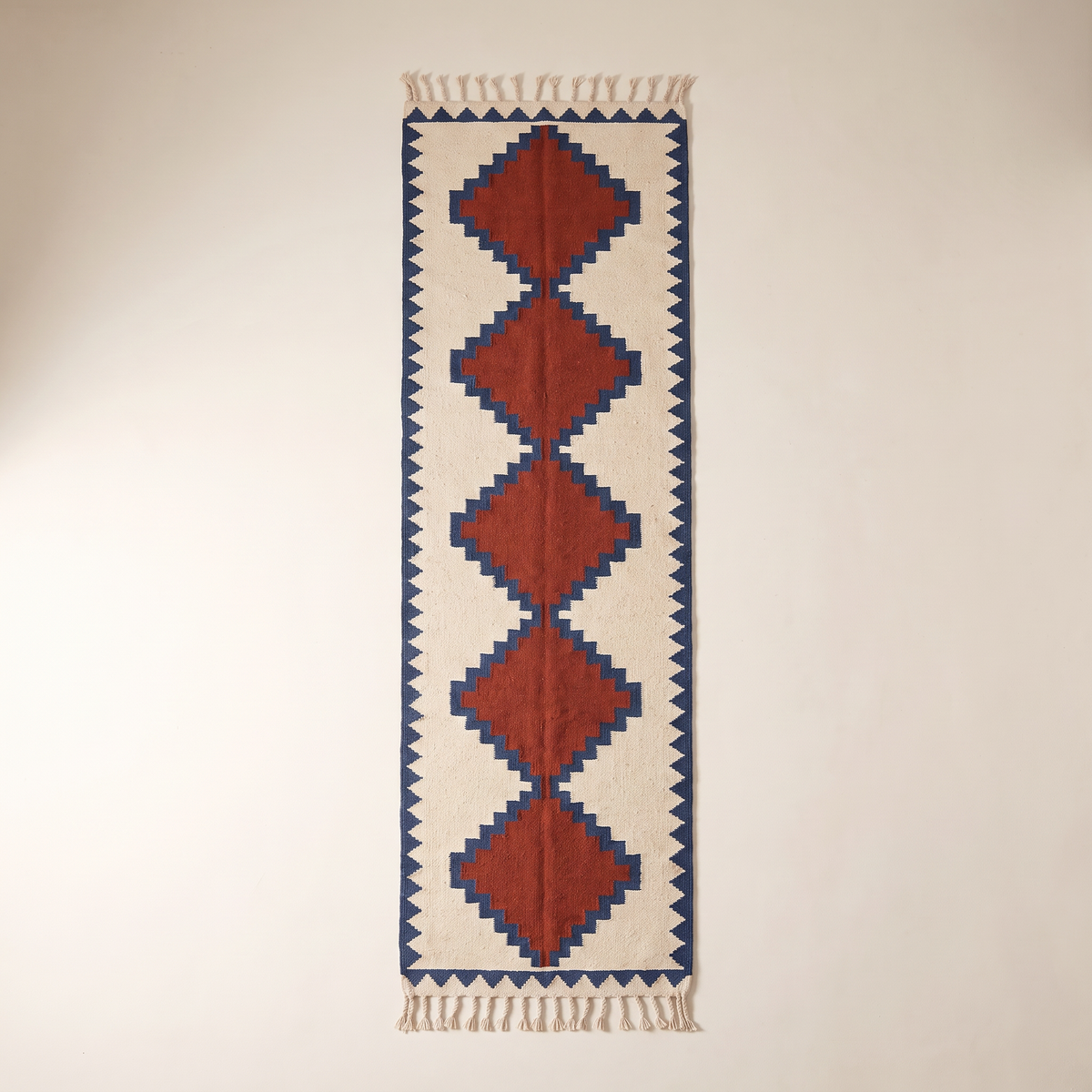 Kilim Runner overhead flat lay showing the full chain of stepped diamonds and triangle border