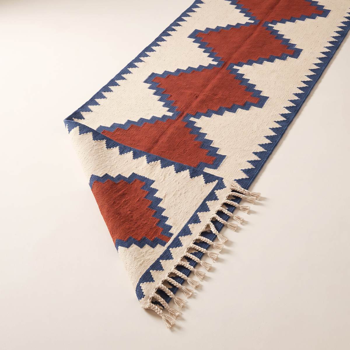 Kilim Runner with one end folded back to show the reversible flatweave