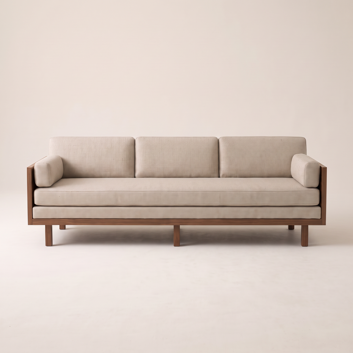 Kora Wood three-seat sofa in oatmeal upholstery with walnut veneer panel arms, front view