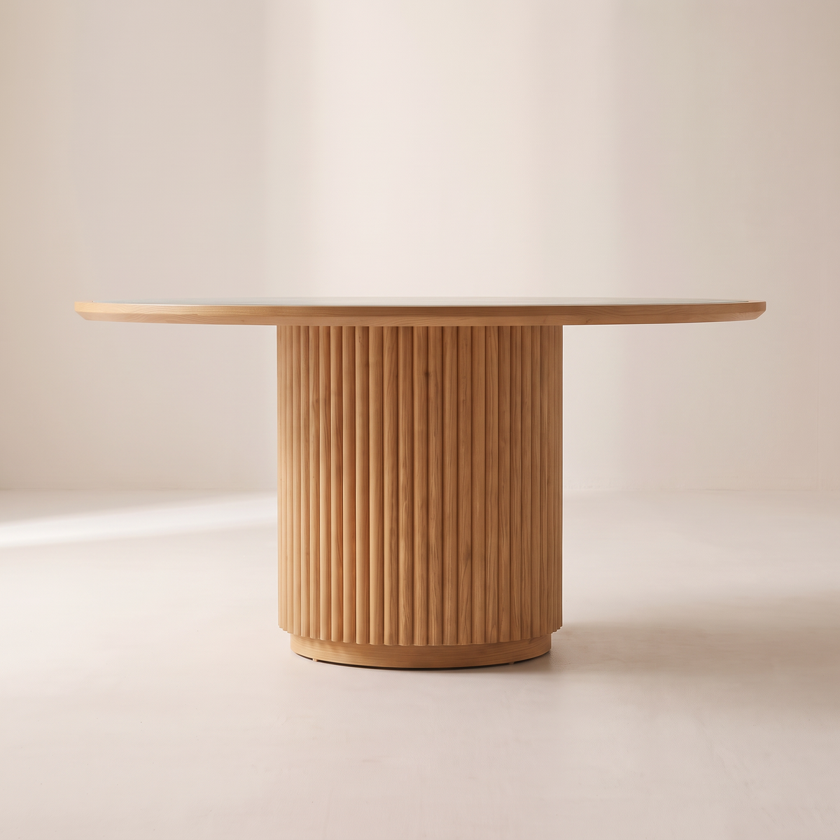 Kota Round dining table, level side elevation showing the stone top edge and fluted ash drum base