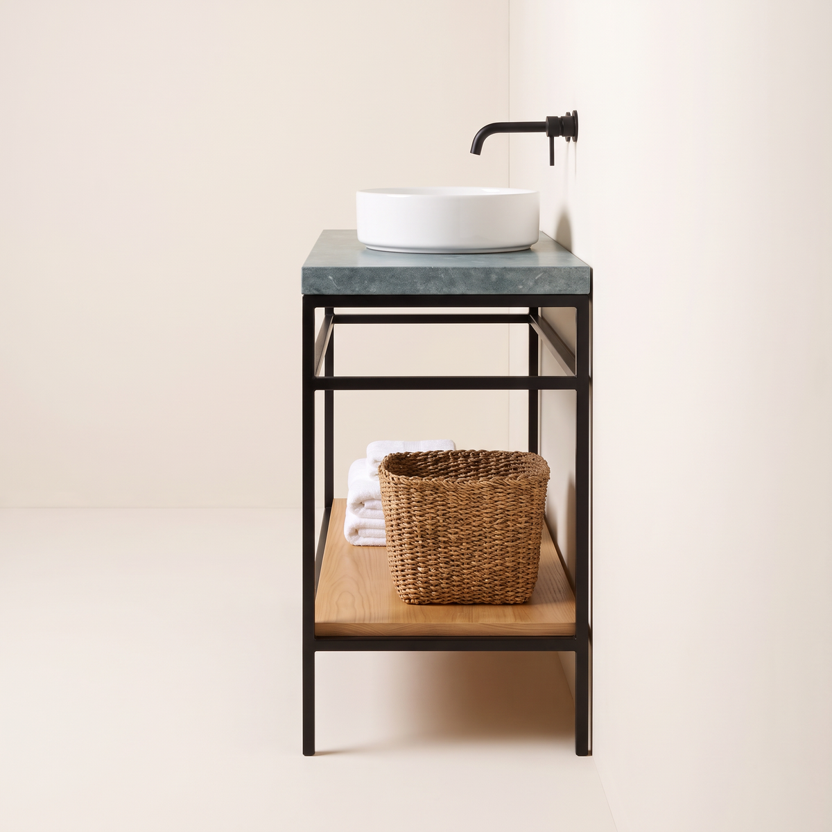 Kota Vessel Vanity end view showing the slim black frame, stone slab thickness and ash shelf