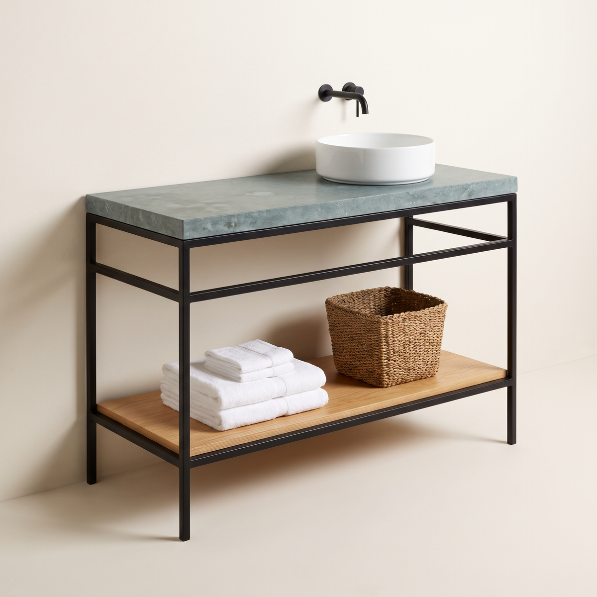 Kota Vessel Vanity with honed blue-grey Kota stone top, round white vessel basin, black wall tap, slim black steel frame and ash shelf with towels and basket, three-quarter studio view