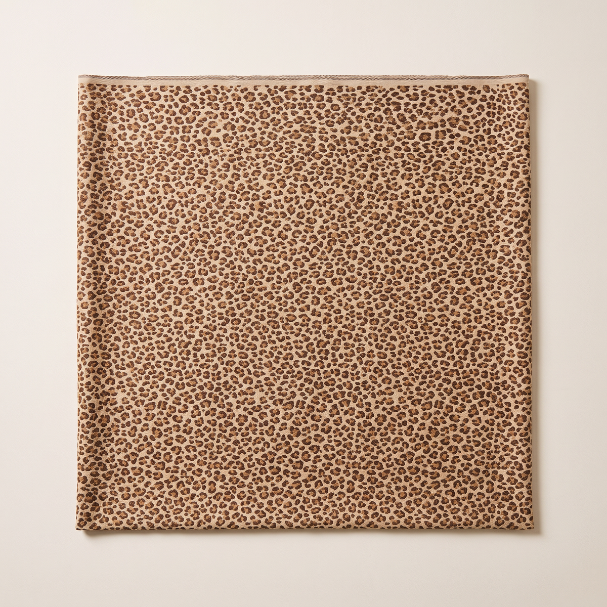 Leopard Jacquard upholstery fabric, flat swatch seen from above showing the all-over leopard pattern