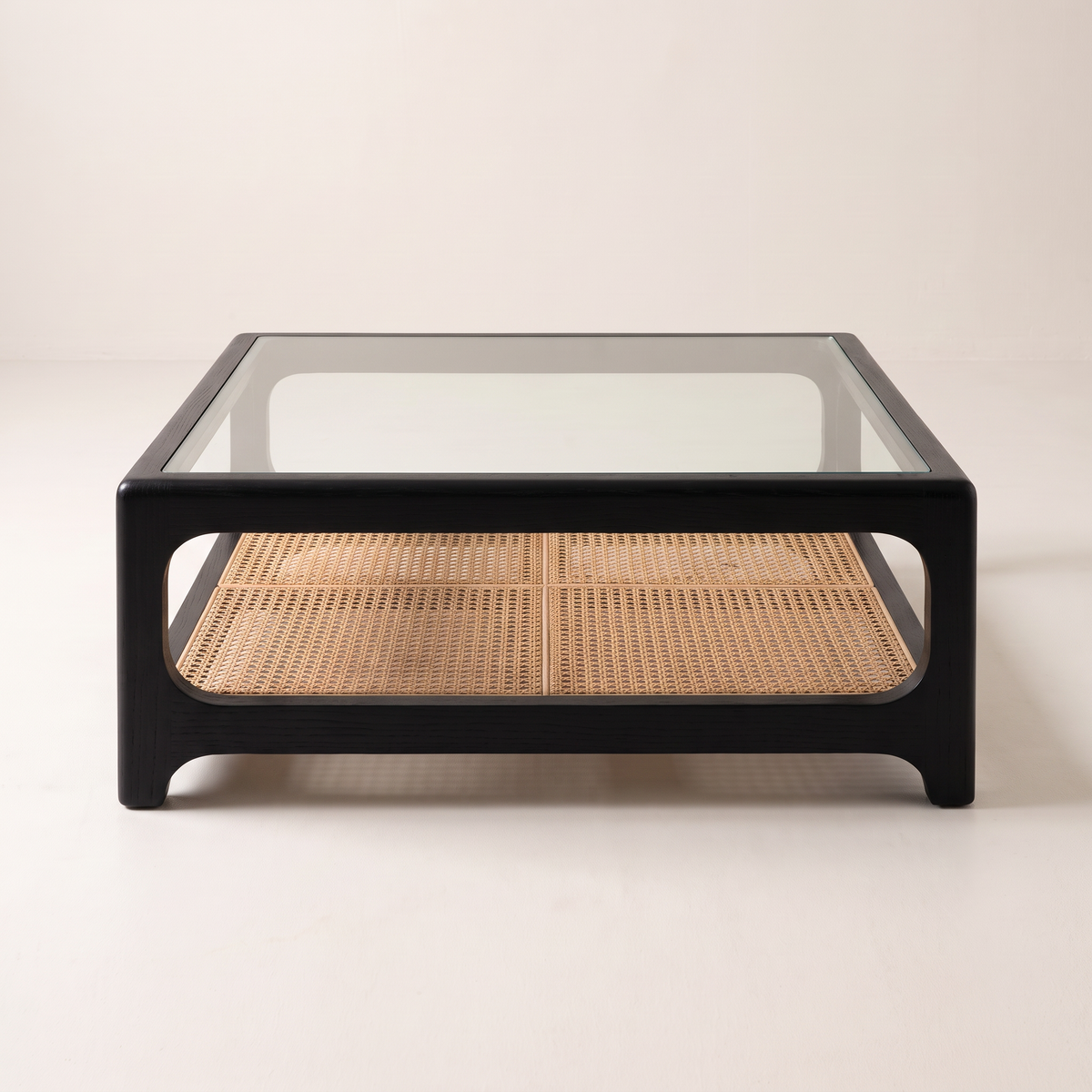 Linea Cane Black coffee table with black ash frame, clear glass top and natural cane shelf, front elevation