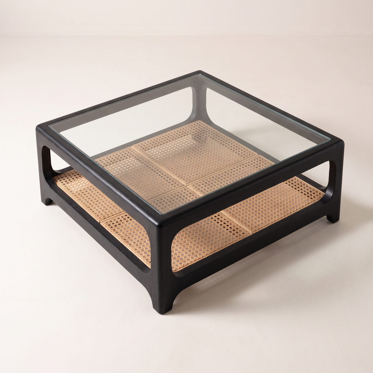 Linea Cane Black coffee table seen from above, cane shelf visible through the clear glass top
