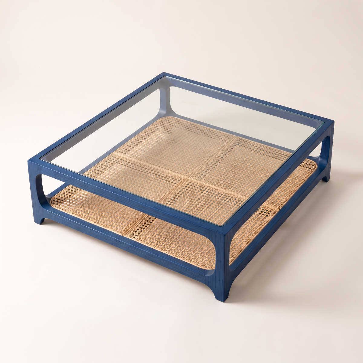 Linea Cane Blue coffee table seen from above, cane shelf visible through the clear glass top