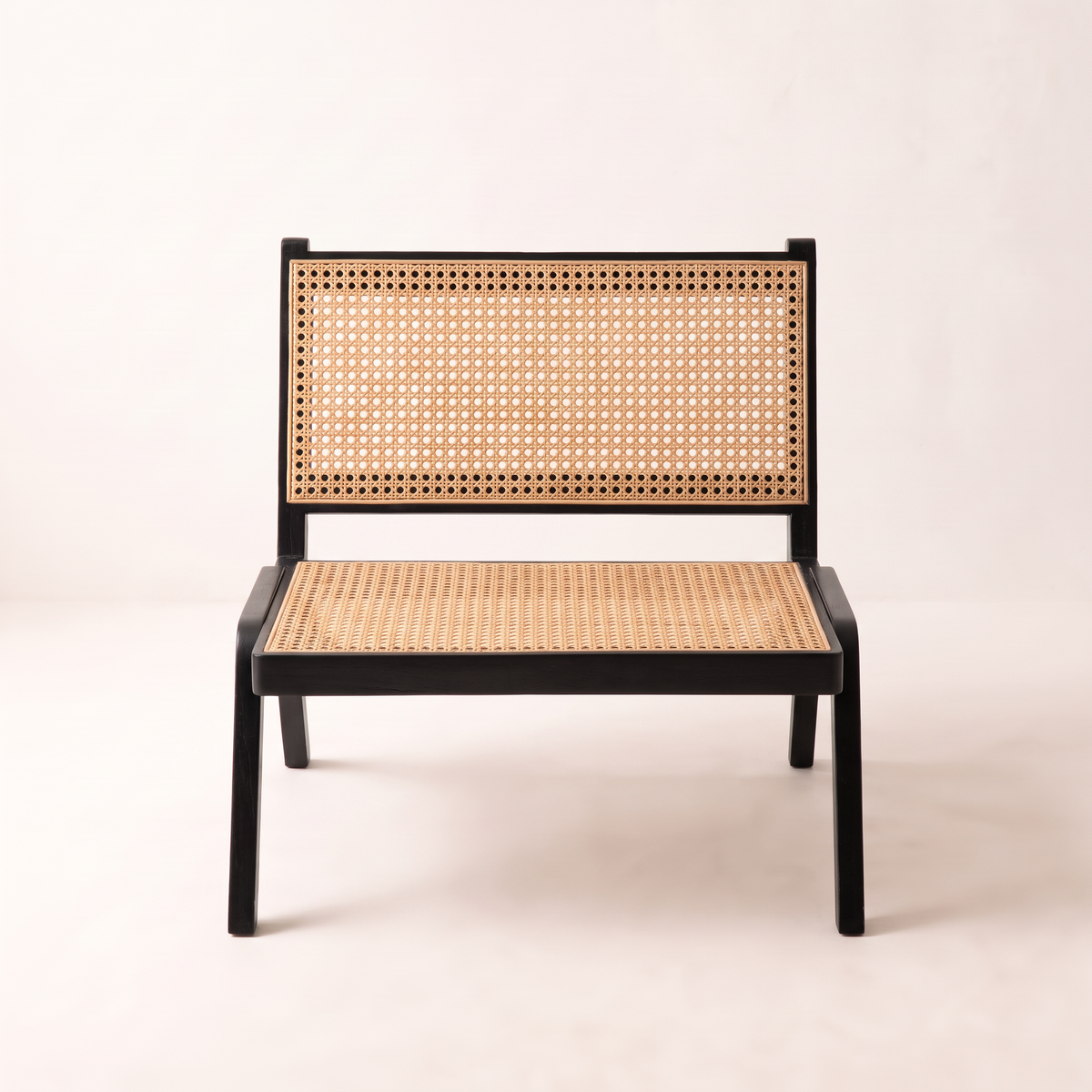 Loom Black lounge chair, straight front view of the cane seat and back