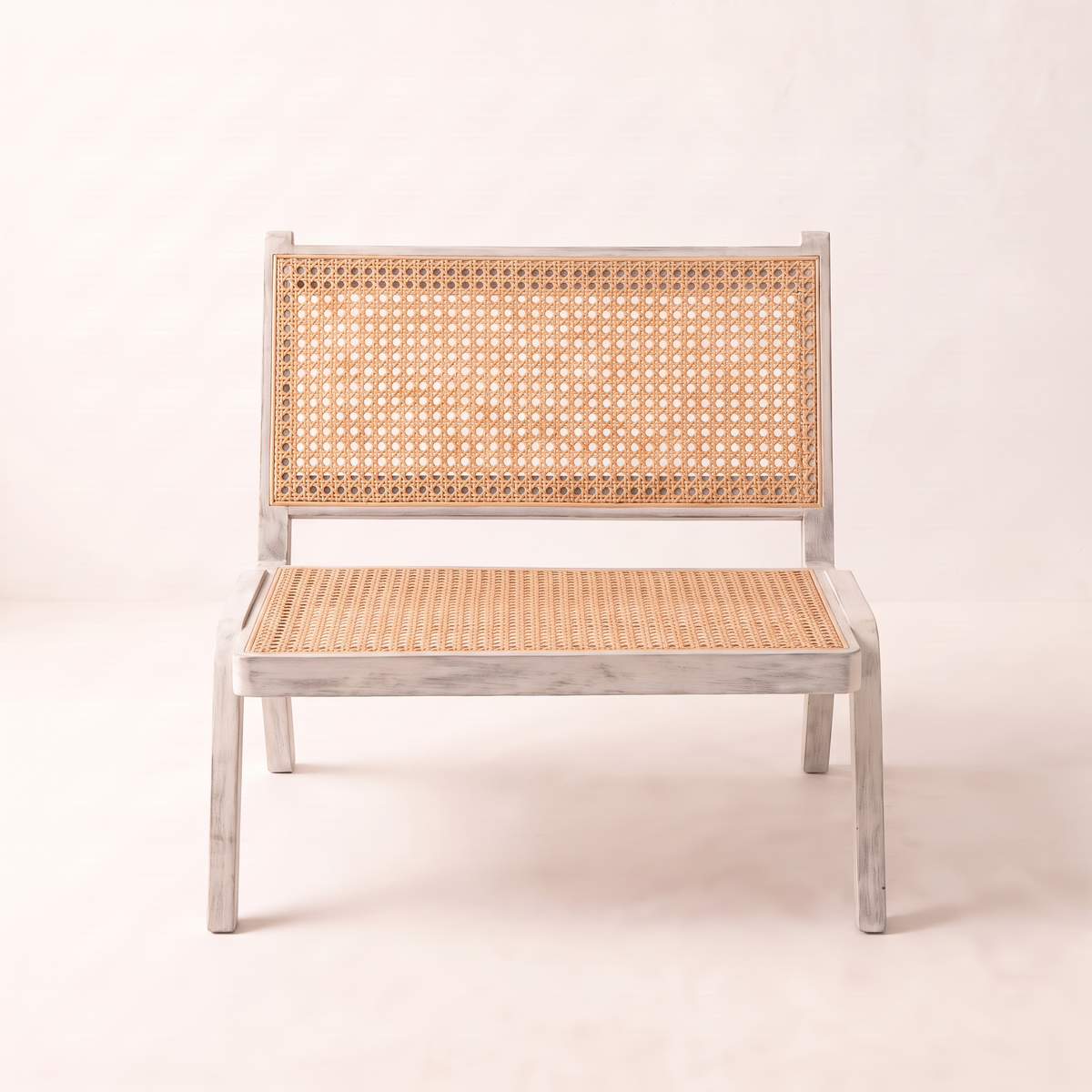 Loom White lounge chair, straight front view of the cane seat and back