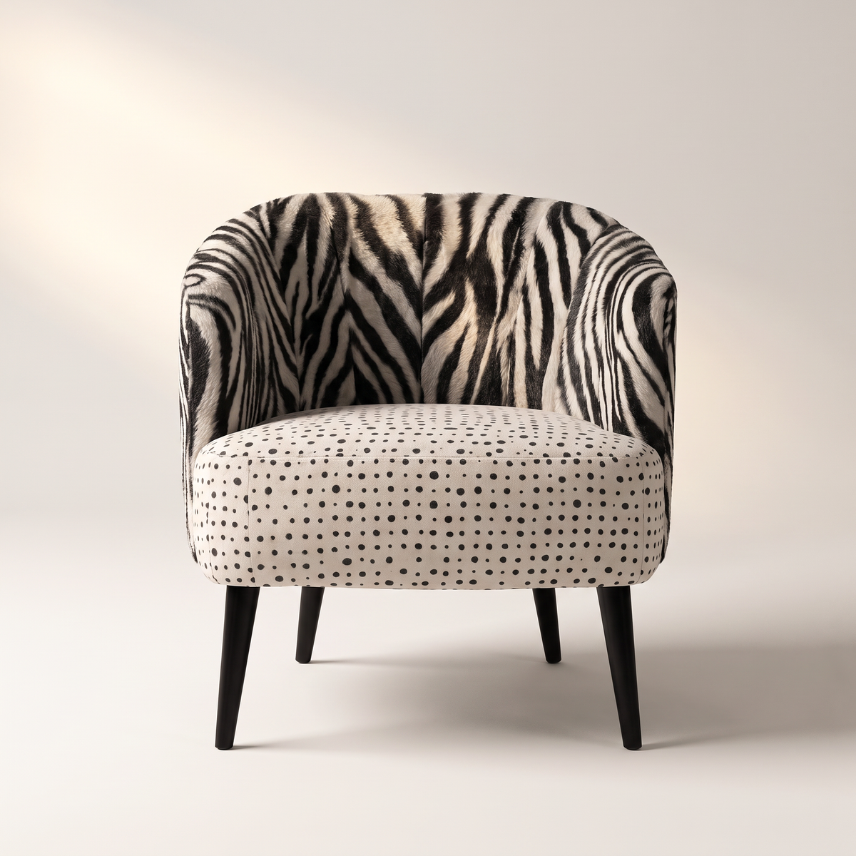 Mono Dot lounge chair in zebra-print shell with polka-dot seat and black tapered legs, front view