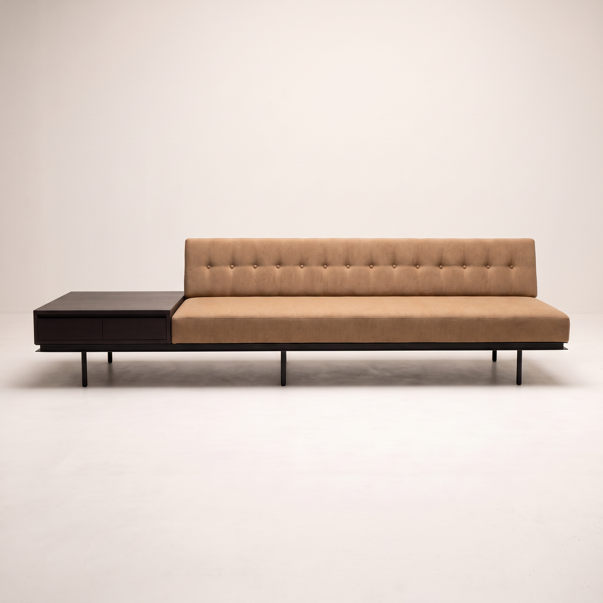 Monolith Brown sofa in camel-tan upholstery with integrated dark wood drawer table, front view