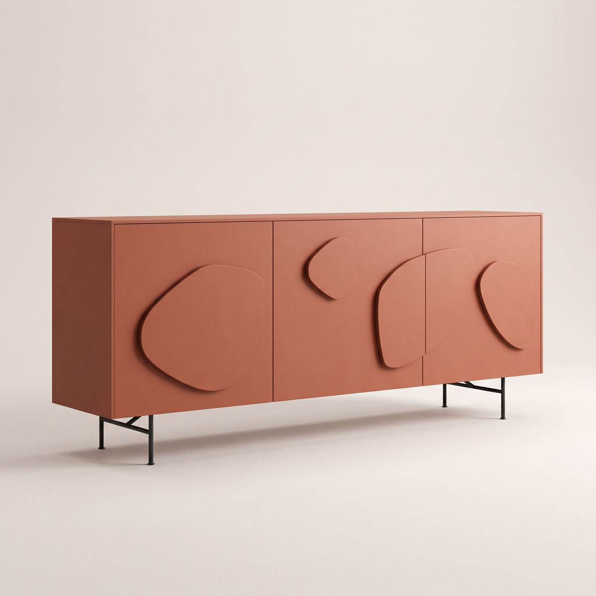 Mora Red storage cabinet in matte terracotta red with raised pebble relief doors and black metal legs, front three-quarter view