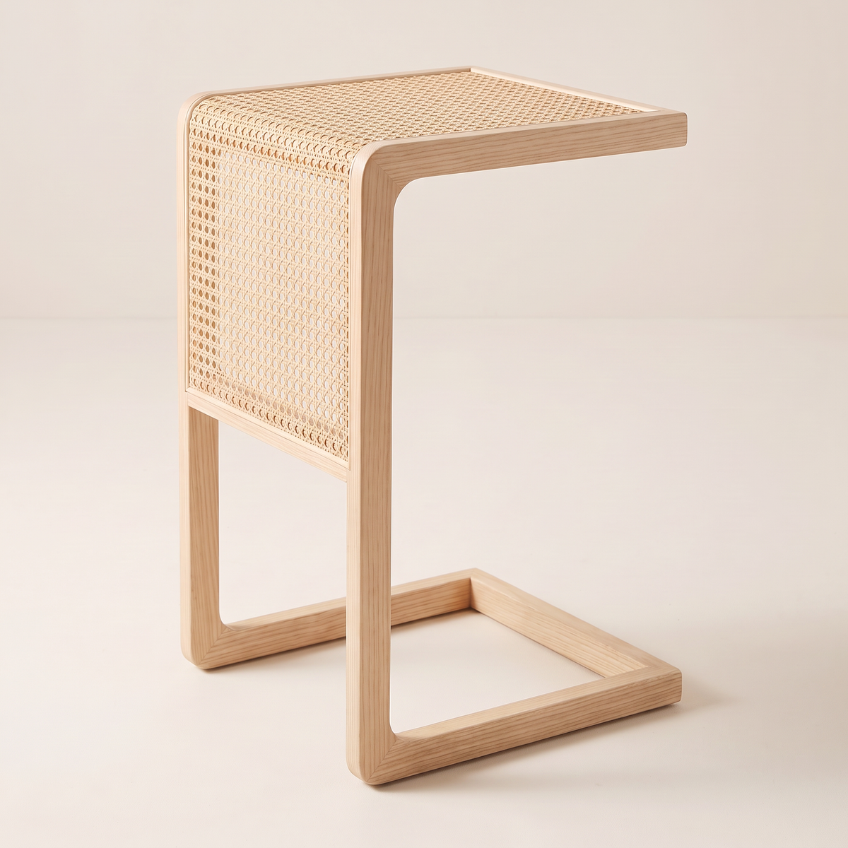 Night Stand 818 C-shaped bedside table in pale ash and cane, opposite three-quarter view
