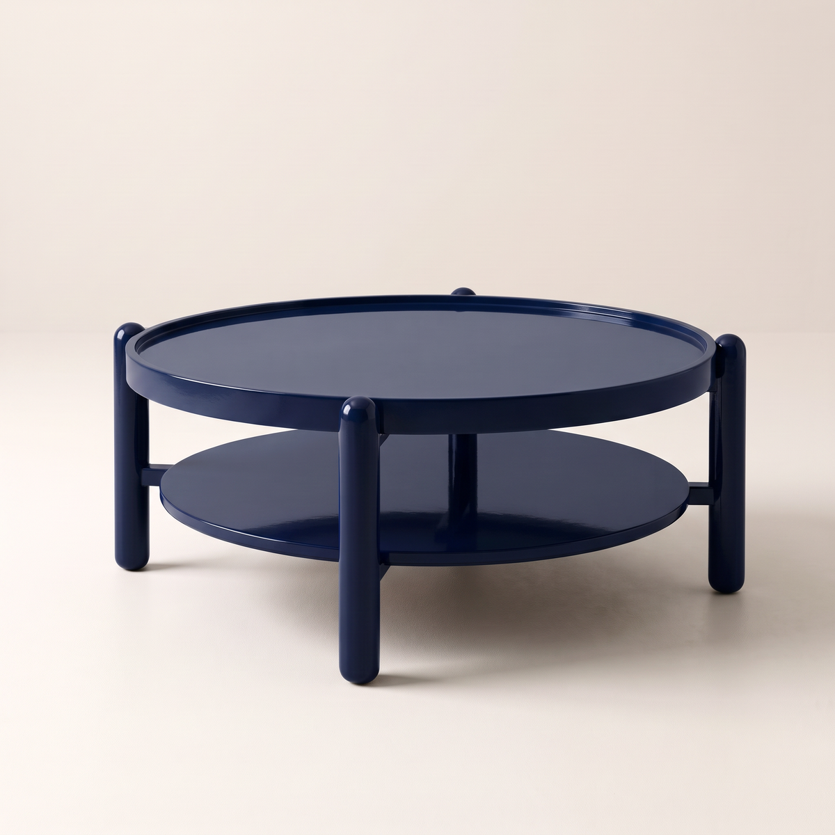 Noir Blue round two-tier coffee table in glossy navy, front-right view