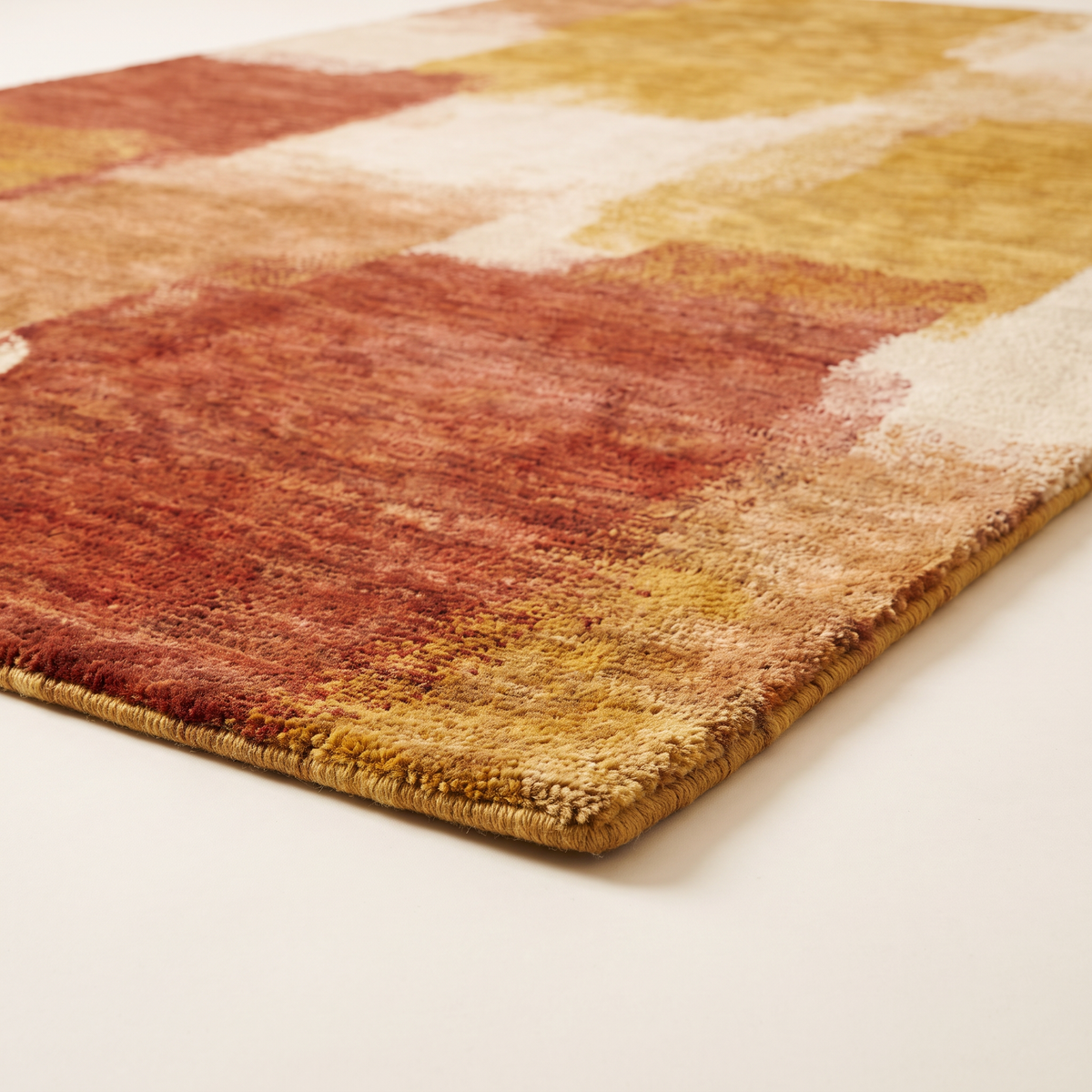 Ochre Field Rug corner close-up showing short dense knotted wool pile and bound edge