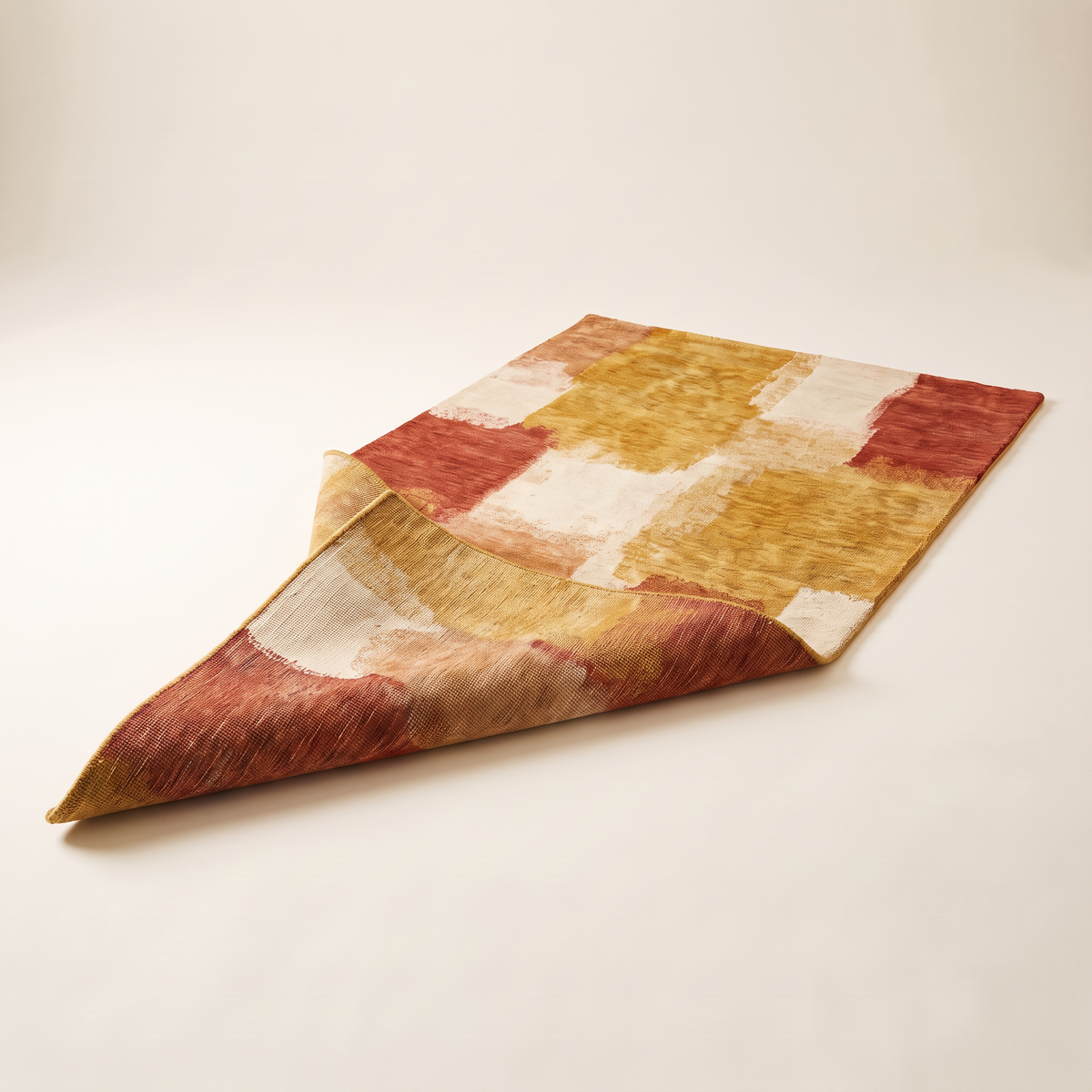 Ochre Field Rug folded back to show the hand-knotted reverse and edge finish