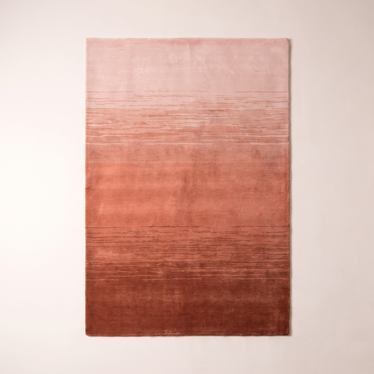 Ombre Dusk Rug overhead flat lay showing the full rust to blush gradient