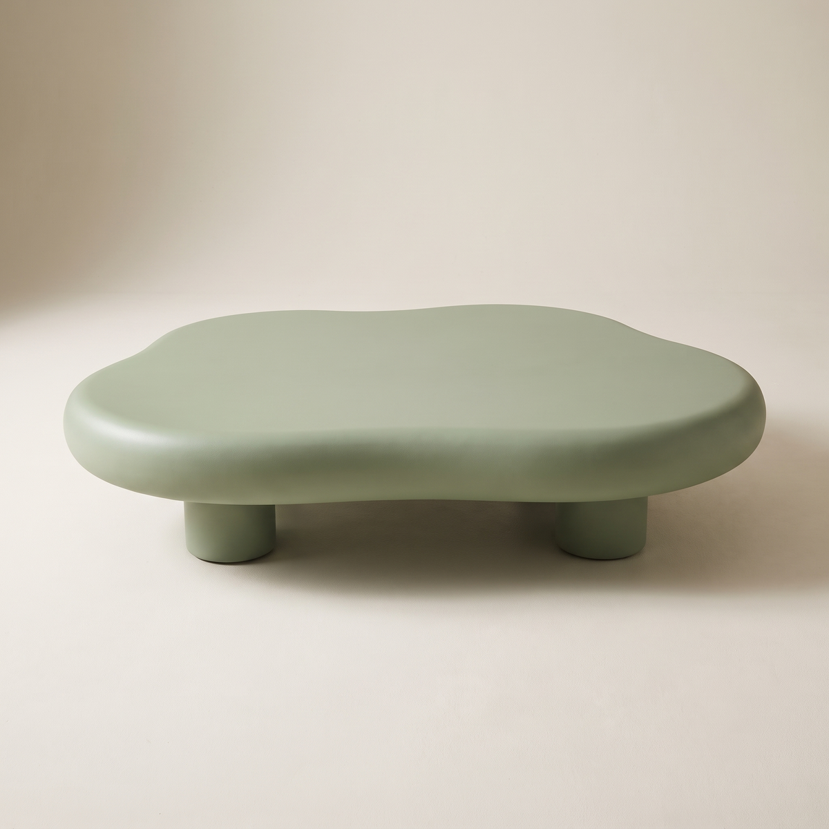 Pebble Sage free-form coffee table in matte sage green, front view