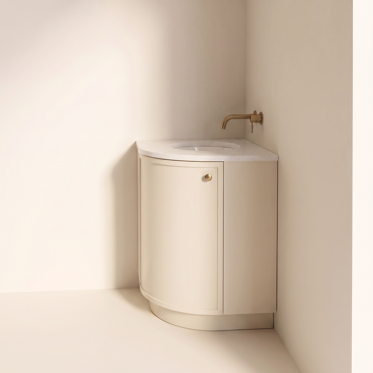 Petite Corner Vanity in ivory with curved door and brass knob, angled view from the other side