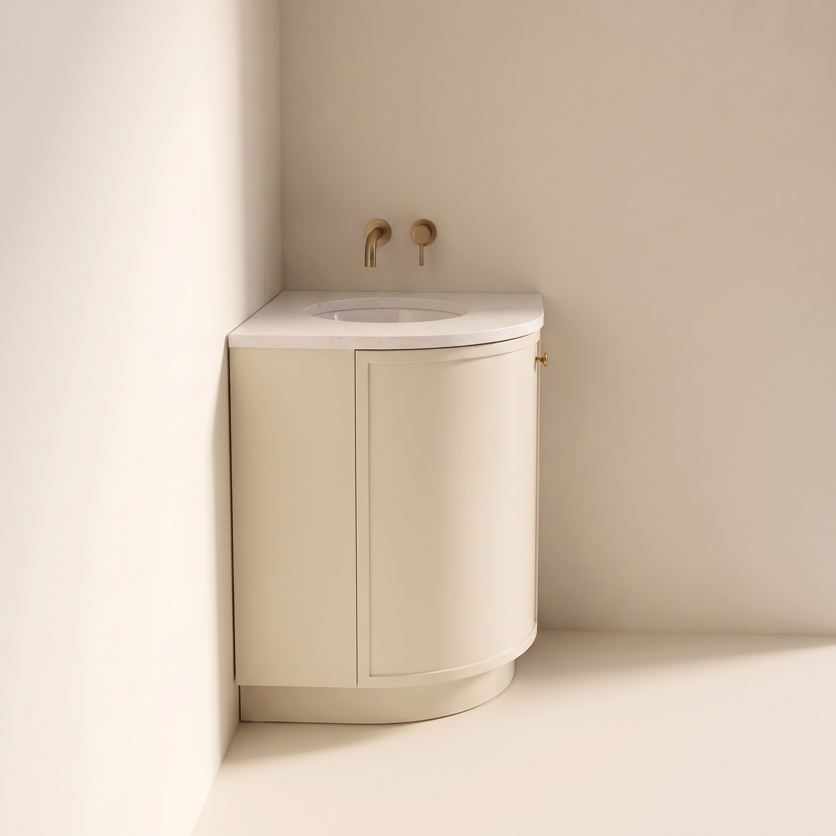 Petite Corner Vanity in ivory seen from the side, showing the curved front and recessed plinth