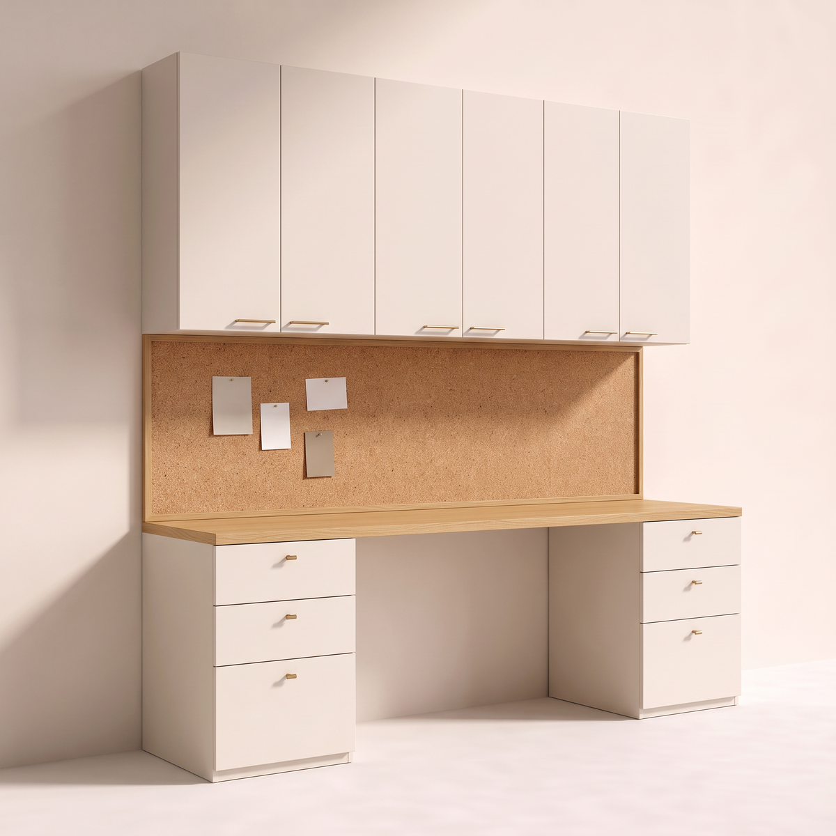 Pinboard Wall Study built-in study wall with honey ash desk top between ivory drawer pedestals, full-width cork pinboard and ivory overhead cabinets with brass pulls, front three-quarter view