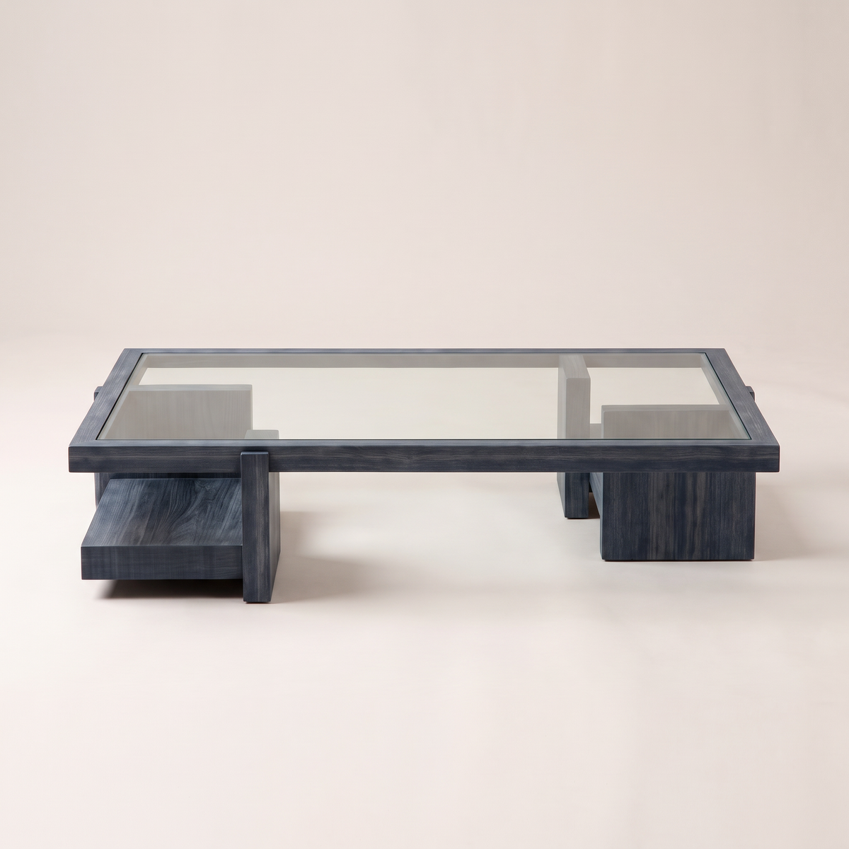 Plinth Blue glass-top coffee table in slate blue-grey wood, front view