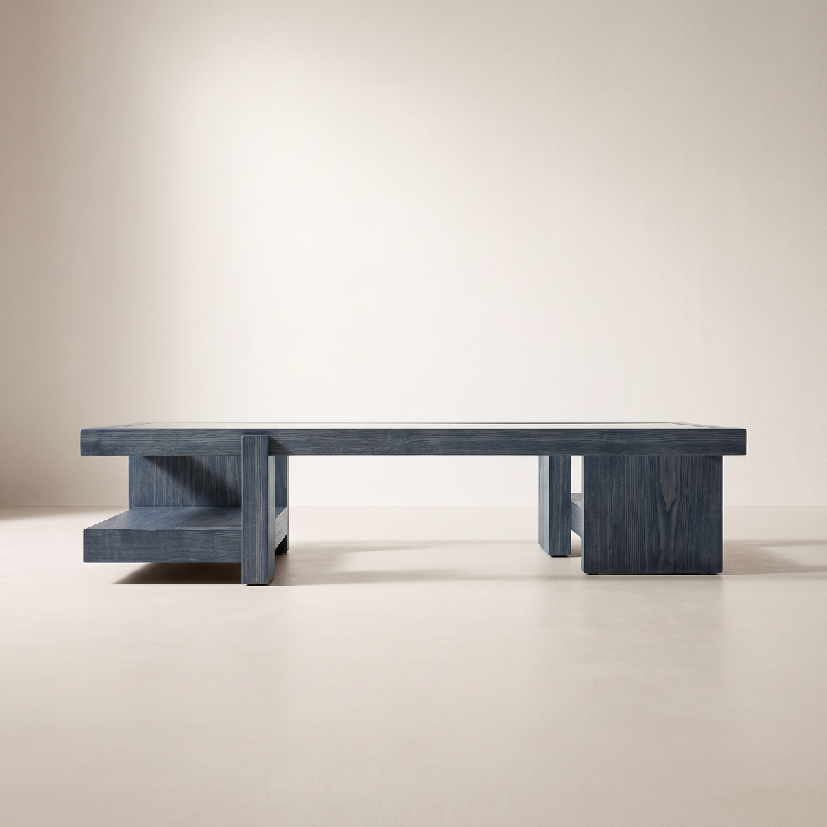 Plinth Blue coffee table in slate blue-grey wood showing both block plinth bases, long-side elevation view
