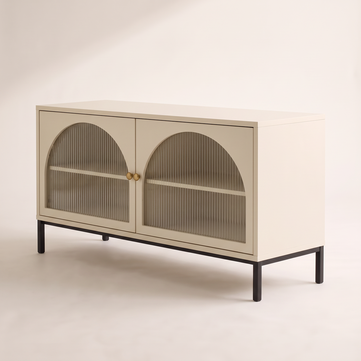 Portal Low cabinet in cream with arched reeded-glass doors and black metal base, front-right three-quarter view