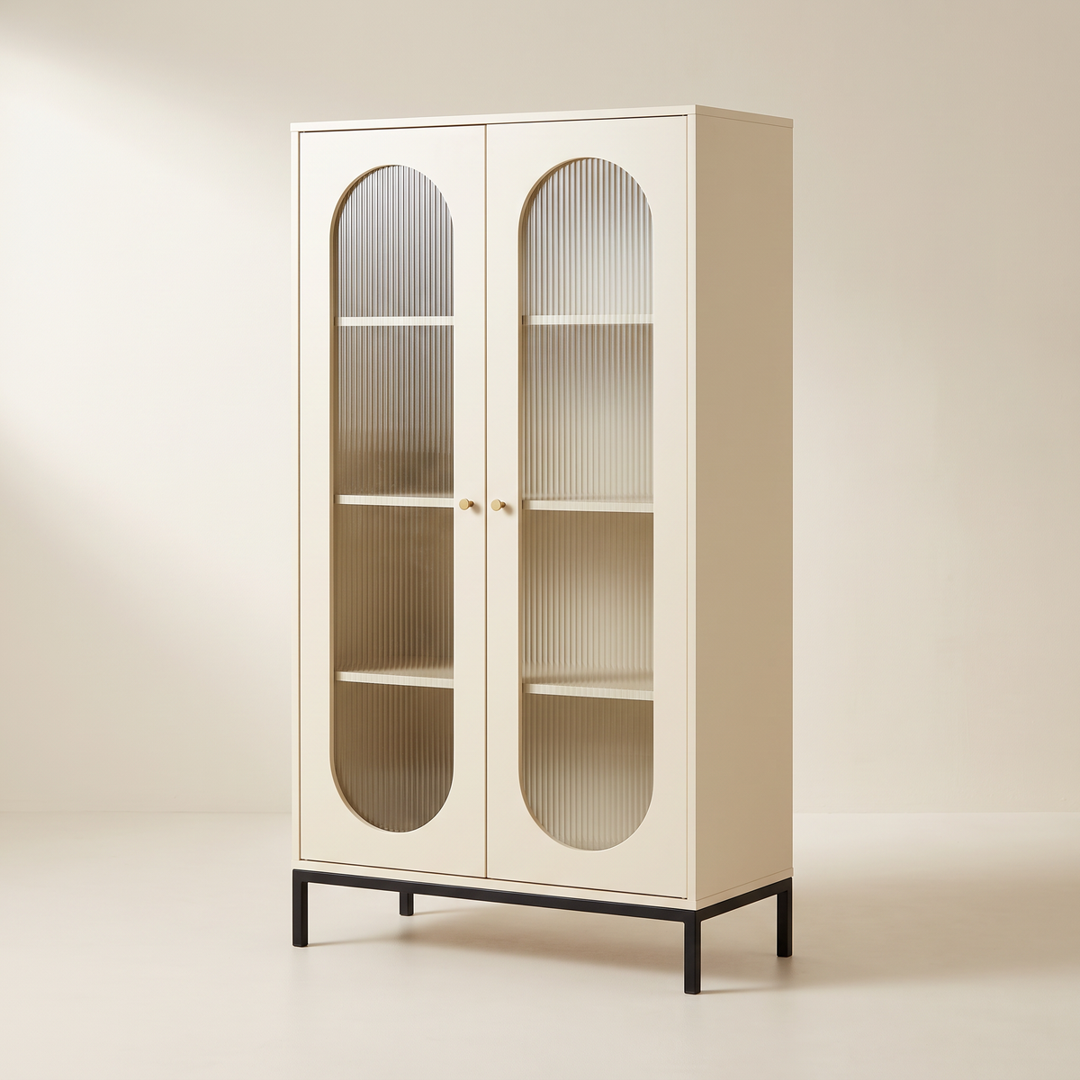 Portal Tall cabinet in cream with capsule reeded-glass doors and black metal base, front-right three-quarter view