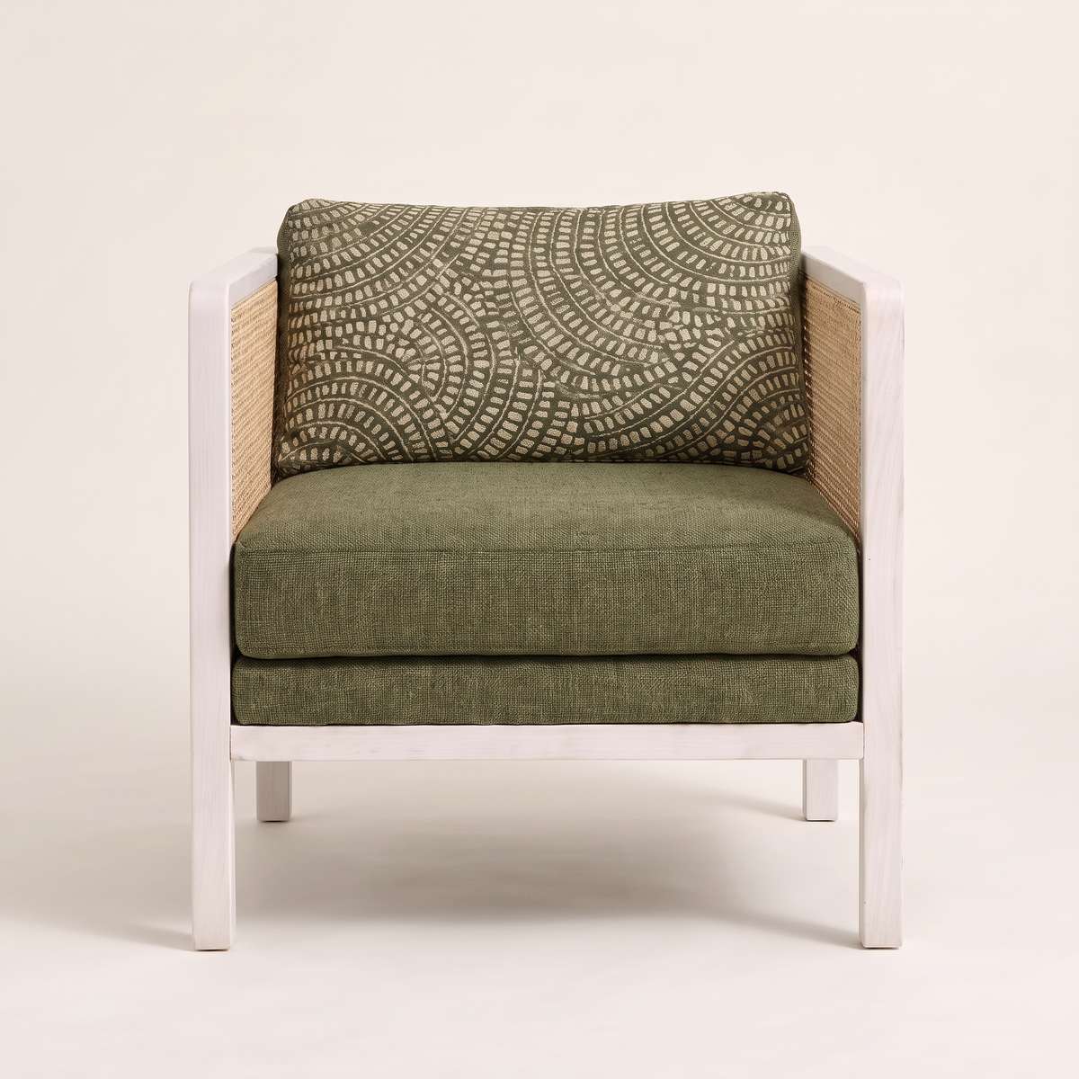 Raffia White lounge chair, straight front view with olive seat cushion and patterned back cushion