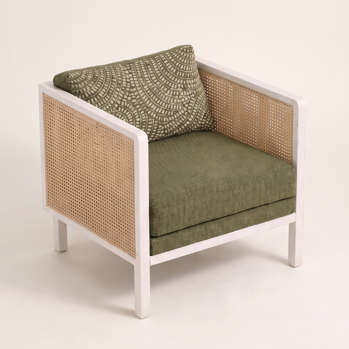 Raffia White lounge chair, elevated three-quarter view showing the cushions and cane arms