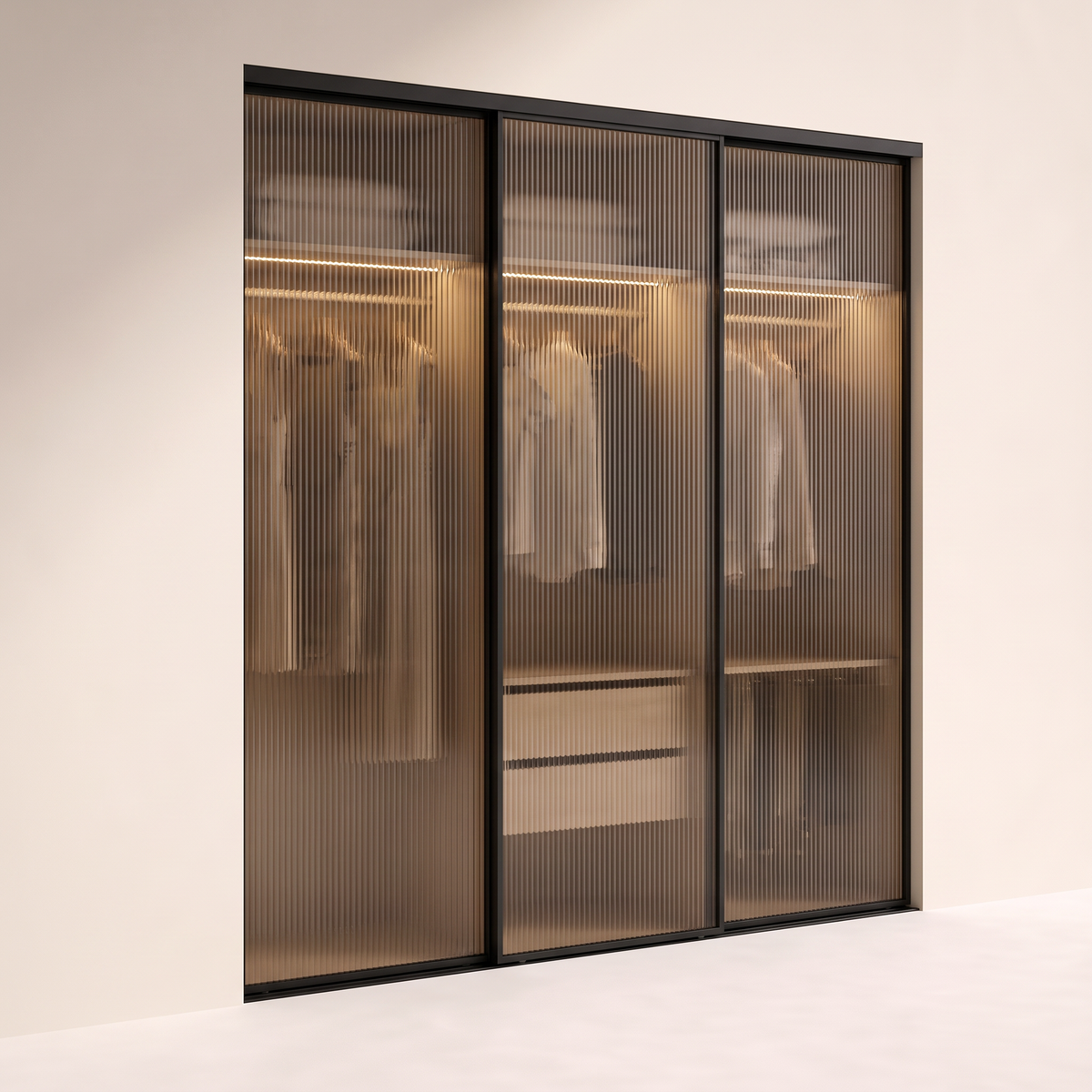 Ripple Sliding Wardrobe with three fluted bronze-glass sliding doors in slim black aluminium frames, front three-quarter view