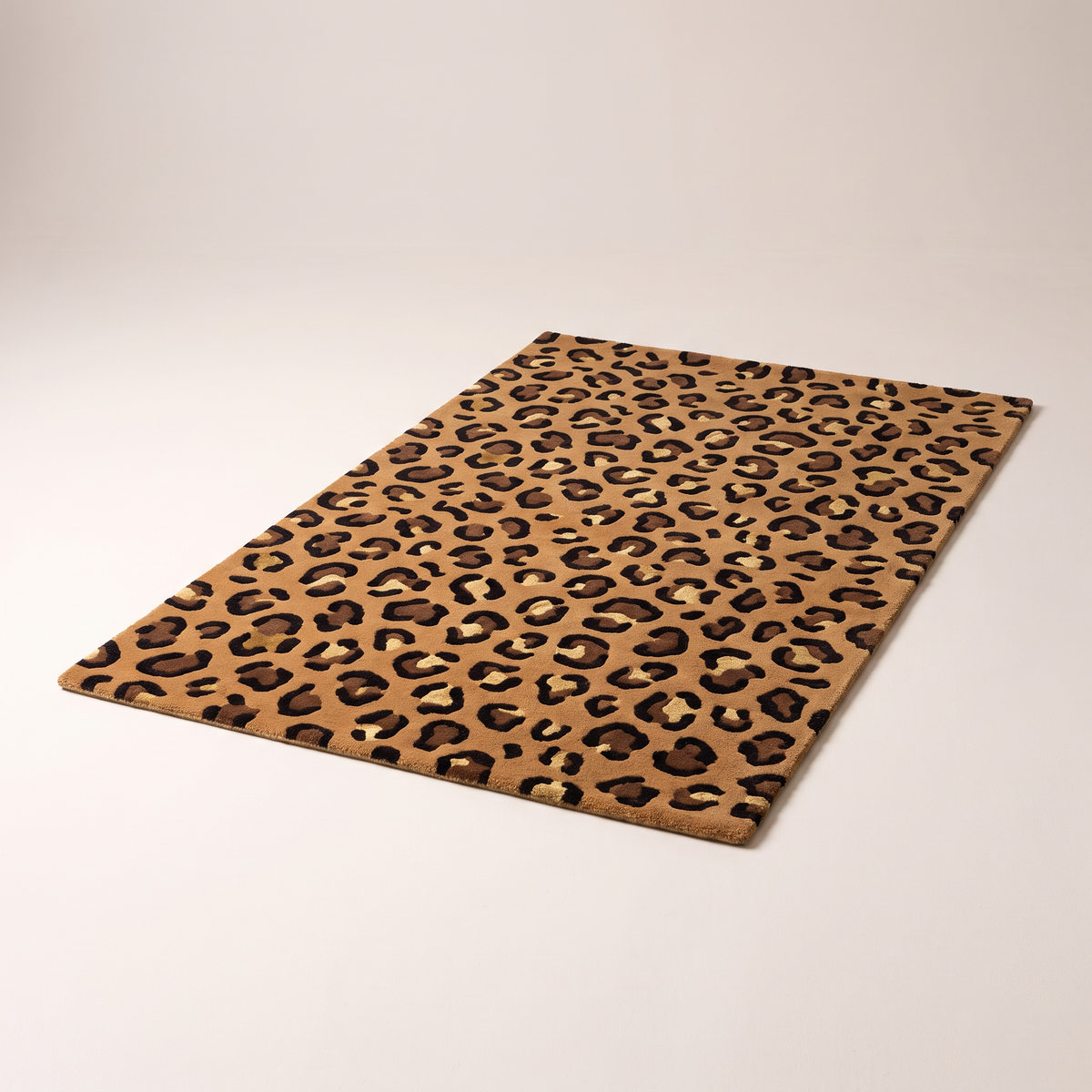 Rosette Leopard Rug, hand-tufted caramel wool with chocolate leopard rosettes, elevated three-quarter view