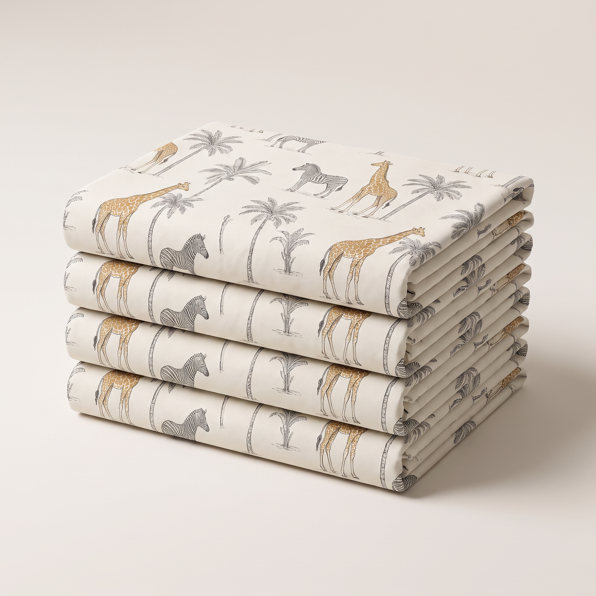 Safari Toile upholstery fabric, neatly folded stack of printed ivory canvas