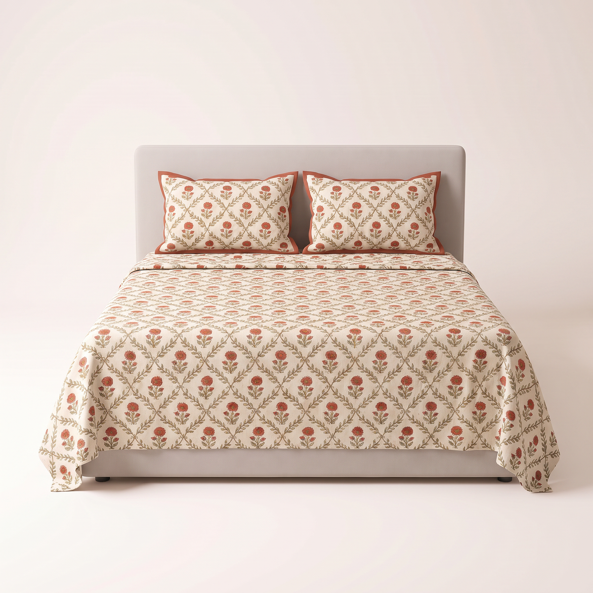 Sanganer Block Sheet Set rust and olive jaal print on ivory, view from the foot of the bed