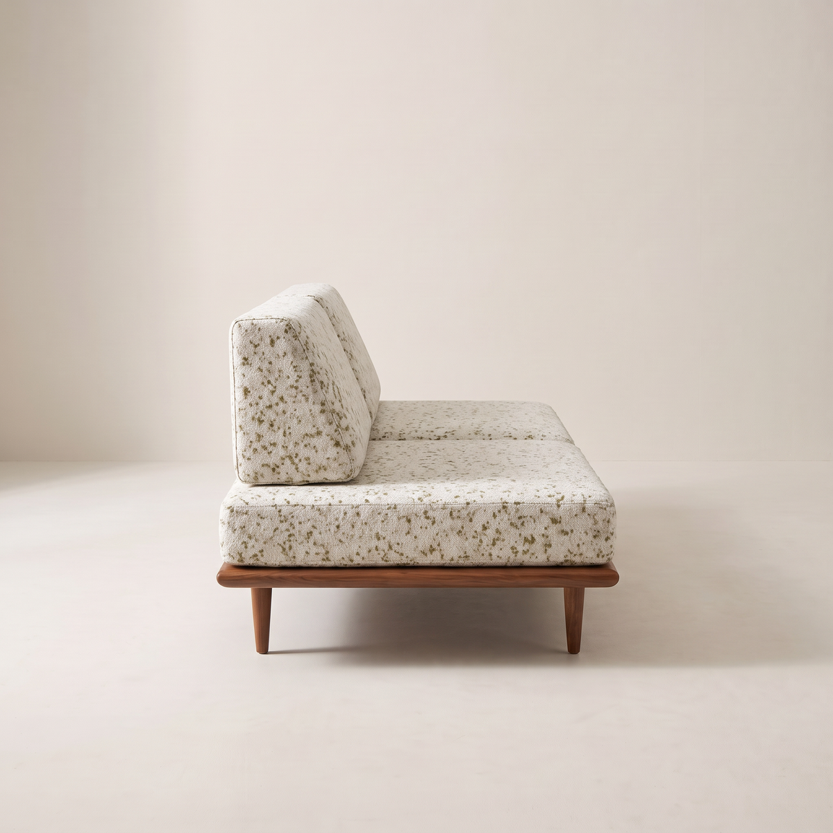 Slat Ivory armless sofa in ivory speckled upholstery with wedge back cushions, side profile view