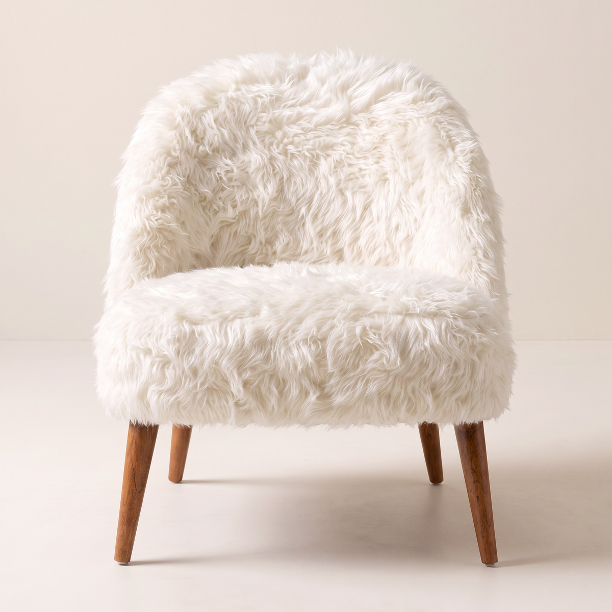 Soft Cloud lounge chair, straight front view in ivory faux fur