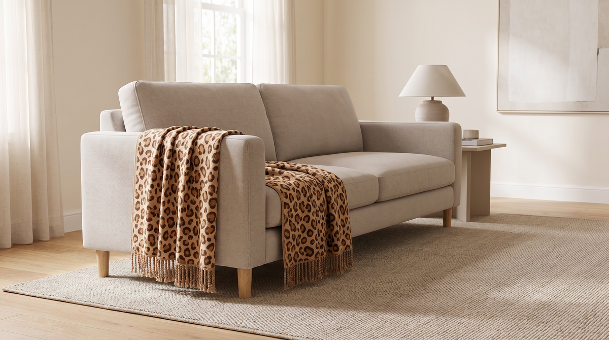 Spotted Fringe Throw draped over a neutral sofa in a calm living room
