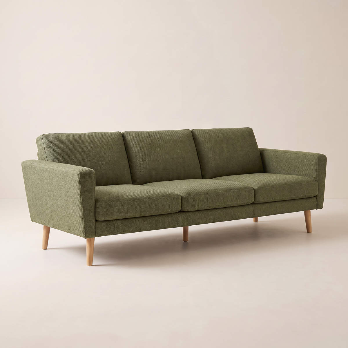 Stay Olive sofa in olive woven upholstery with tapered wooden legs, front right three-quarter view