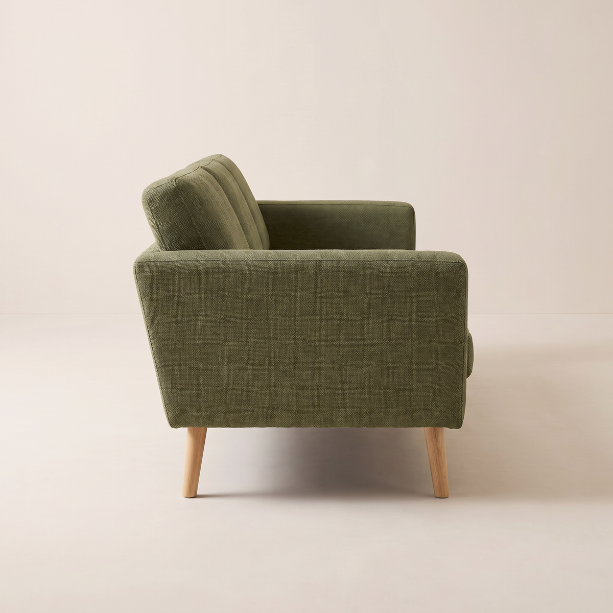 Stay Olive sofa in olive woven upholstery with tapered wooden legs, side profile view