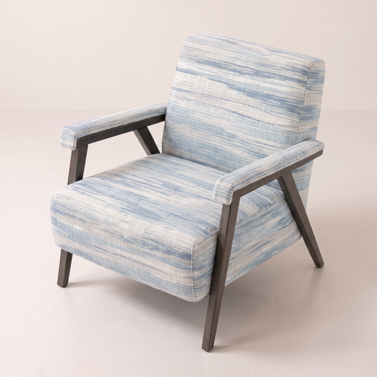 Strata Blue lounge chair in ivory and blue ikat-streaked fabric, elevated view from above