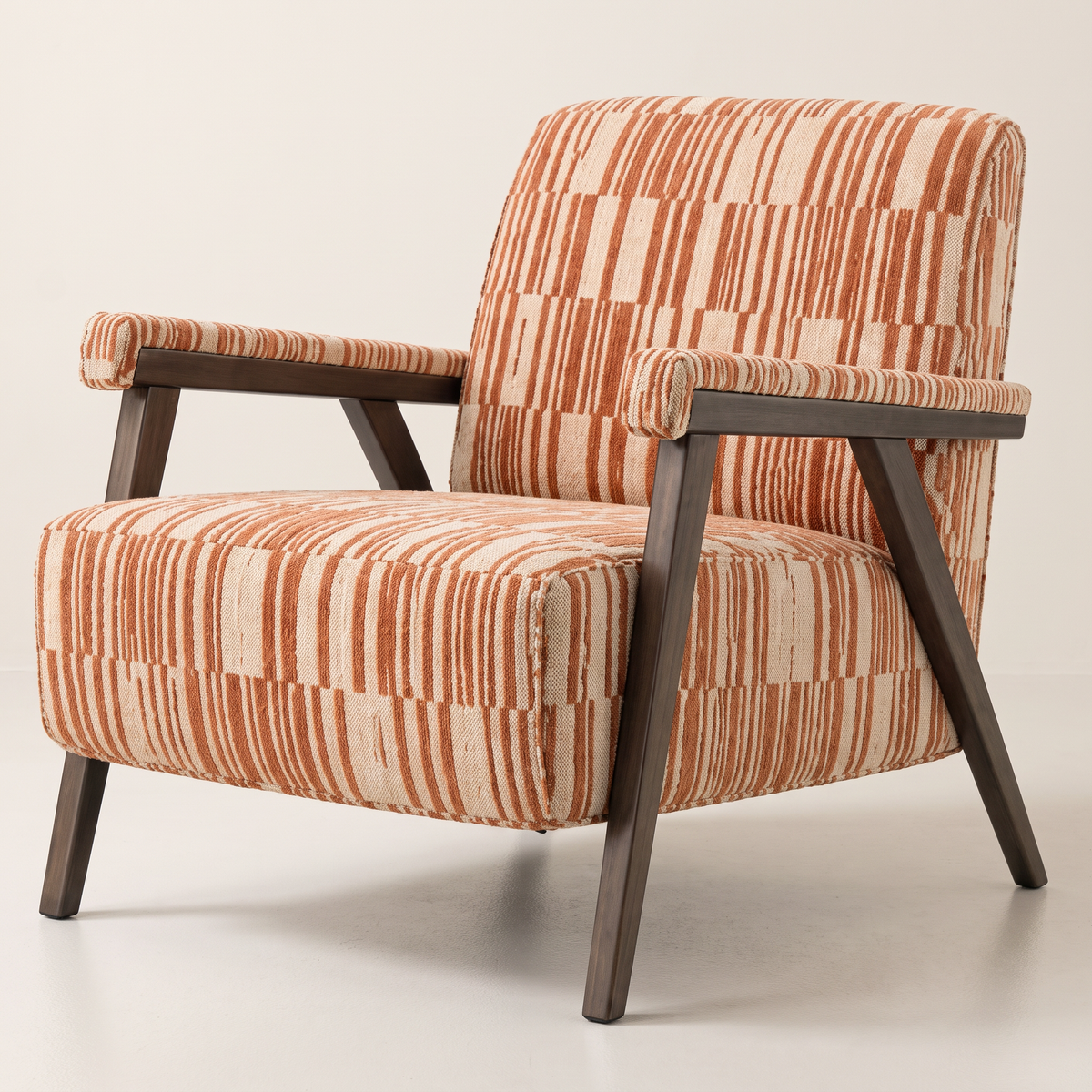 Strata Red lounge chair in cream and rust striped fabric with slim dark wooden frame, front three-quarter view