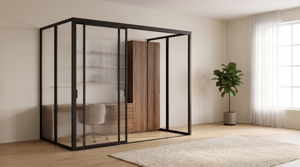 Studio Glass Office fluted glass home office enclosure styled in a calm open-plan room