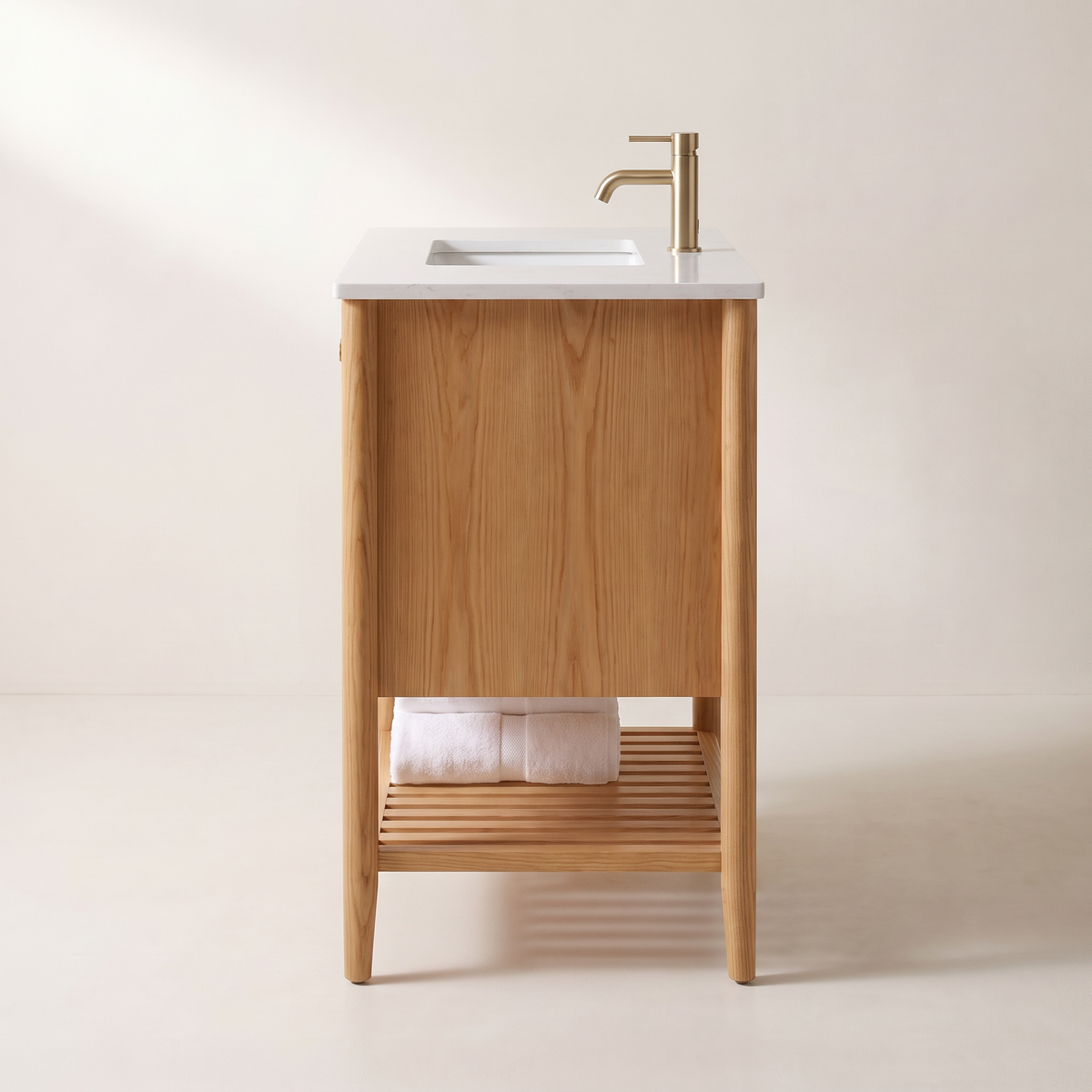 Tala Cane Vanity side profile showing ash side panel, tapered legs and slatted shelf